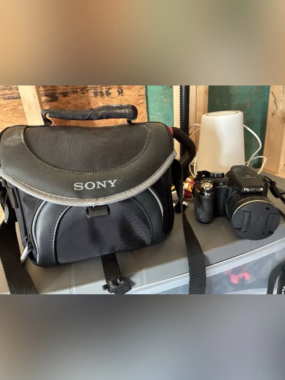 Fujifilm FinePix S-series digital camera with travel case